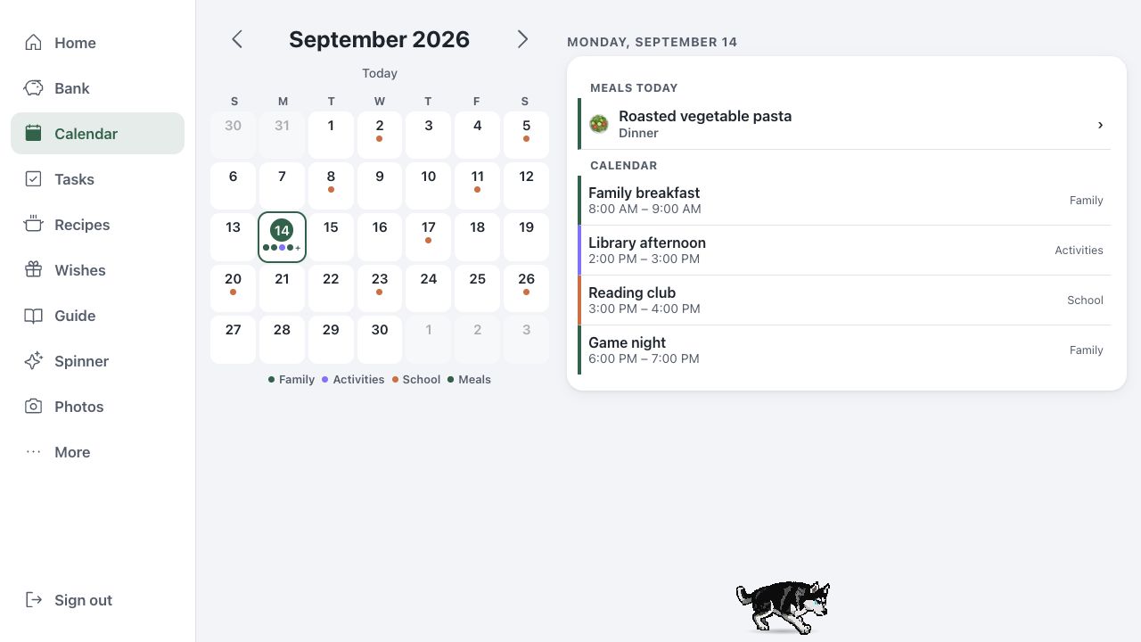 Our Book calendar with a month grid, family events, and a planned meal, using fictional sample data.